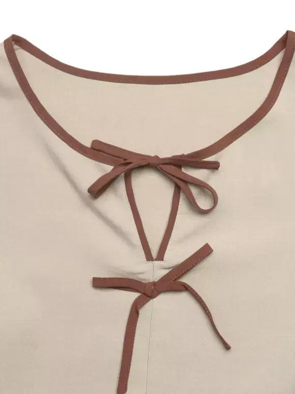 Blouse péplum à col rond et n艙ud contrastant manches bouffantes et manches bouffantes
