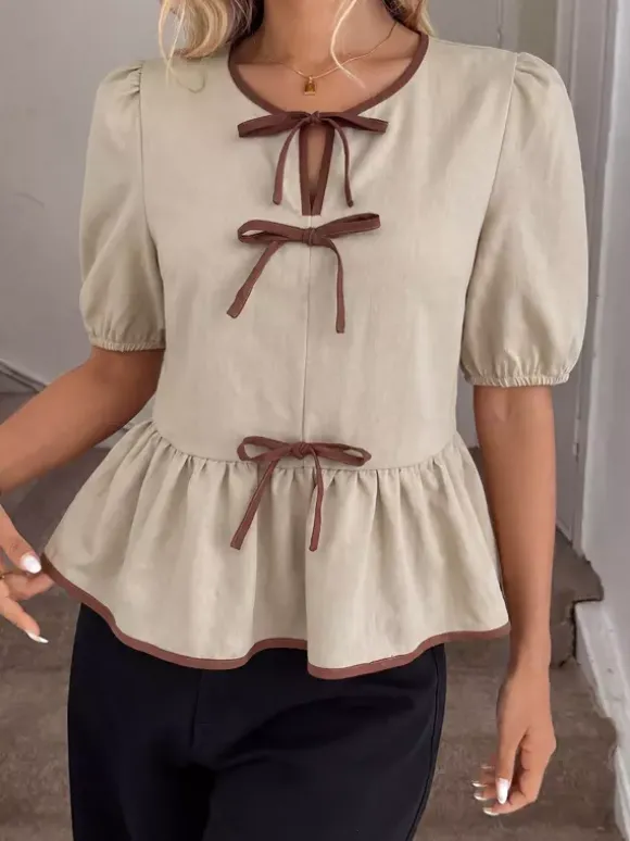 Blouse péplum à col rond et n艙ud contrastant manches bouffantes et manches bouffantes