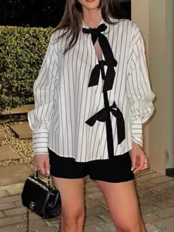 Blouse blanche pour femme col rabattu manches longues style décontracté avec n艙uds.