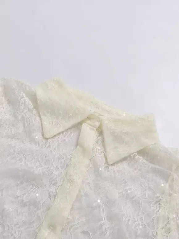 Blouse pour femme en dentelle abricot à volants et col rabattu élégante manches longues.