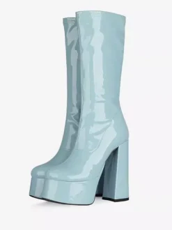 Bottes Gogo jaunes à plateforme et talon compensé en cuir verni brillant.