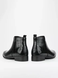 Bottines Chelsea noires à bout rond pour homme motif pierre