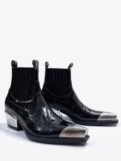 Bottines noires pour homme à bout pointu et talon compensé design