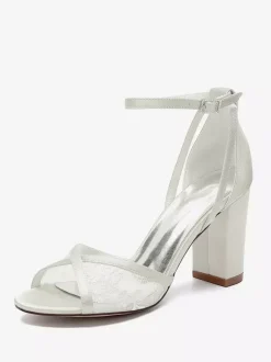 Chaussures de mariage en dentelle ivoire à bout ouvert et talon épais avec bride à la cheville