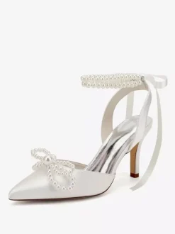 Chaussures de mariage ivoire en satin à bout pointu avec perles et n艙ud à talons hauts