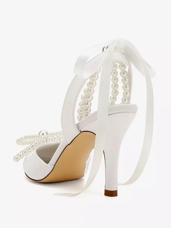 Chaussures de mariage ivoire en satin à bout pointu avec perles et n艙ud à talons hauts