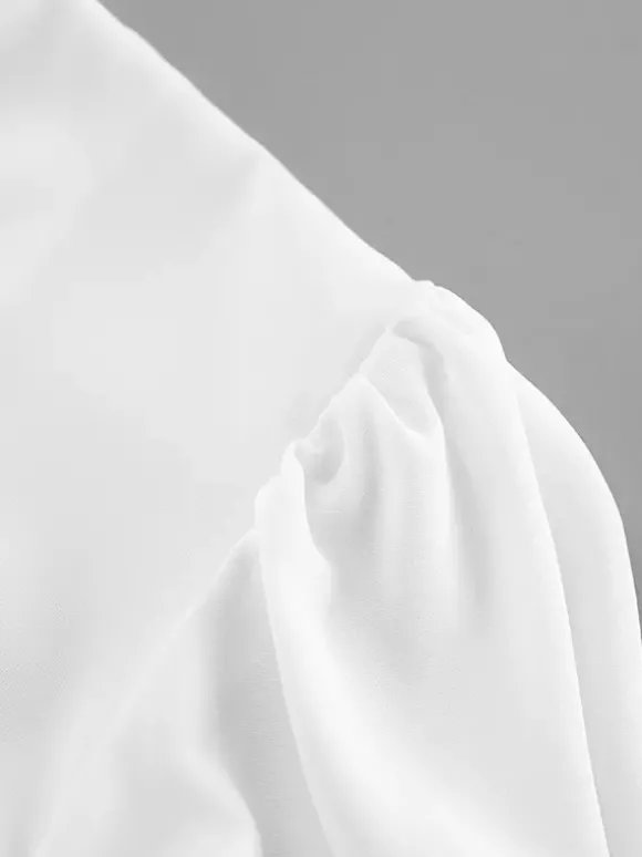 Chemisier péplum blanc élégant pour femme - Col V dos nu manches lanternes coupe ajustée - Idéal pour le printemps et le soir (2026)