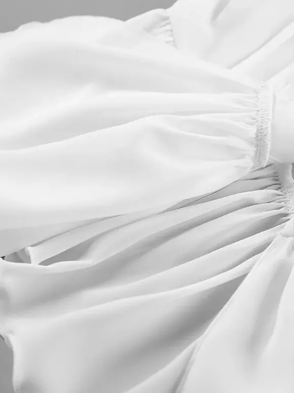 Chemisier péplum blanc élégant pour femme - Col V dos nu manches lanternes coupe ajustée - Idéal pour le printemps et le soir (2026)