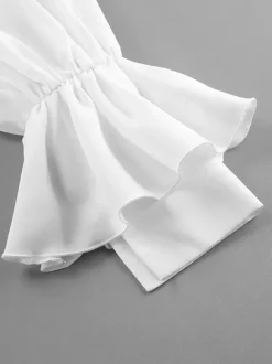 Chemisier péplum blanc élégant pour femme - Col V dos nu manches lanternes coupe ajustée - Idéal pour le printemps et le soir (2026)