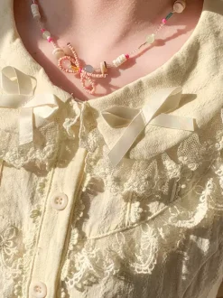 Chemisiers Lolita doux n艙uds en dentelle haut Lolita à manches courtes chemise Lolita noire en dentelle