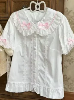 Chemisiers Lolita doux haut Lolita rose à manches courtes volants n艙uds chemise Lolita à blocs de couleurs