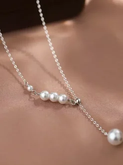 Collier ras-de-cou minimaliste en perles petit collier de devant longue perle pendante. Bijou de cou avec une seule perle.