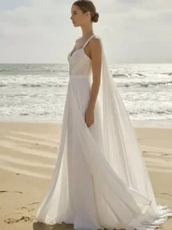 Combinaison de mariée 2 pièces en mousseline plissée avec traîne décolleté c艙ur sans manches taille naturelle couleur ivoire