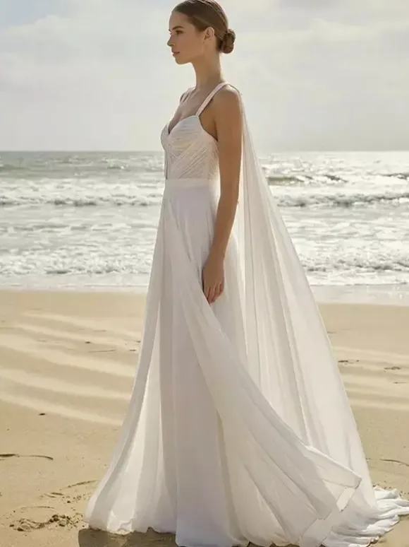 Combinaison de mariée 2 pièces en mousseline plissée avec traîne décolleté c艙ur sans manches taille naturelle couleur ivoire