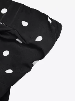 Combinaison noire sans manches et sans bretelles ample tenue d'été une pièce