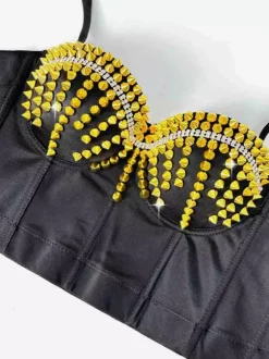 Corsets noirs et dorés sexy sans manches à bretelles et rivets au col.