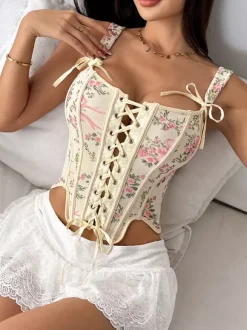 Corsets blancs chics sans manches à bretelles et décolleté ajusté avec n艙uds.