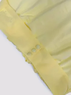 Ensemble deux pièces jaune sexy à volants jupe sans manches à col montant et volants.