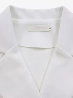 Ensemble deux pièces noir à pois style streetwear décontracté jupe à manches courtes et col rabattu