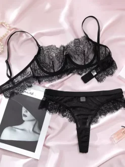 Ensemble soutien-gorge et culotte en dentelle noire transparente à fleurs deux pièces.
