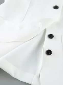 Ensemble deux pièces : boutons blancs col rond chic jupe sans manches.
