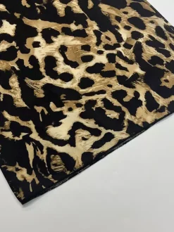 Ensemble deux pièces imprimé léopard haut bustier à manches longues et pantalon.