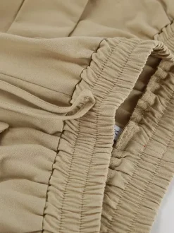 Ensemble deux pièces rose décontracté en coton et lin haut sans manches à col en V et pantalon.