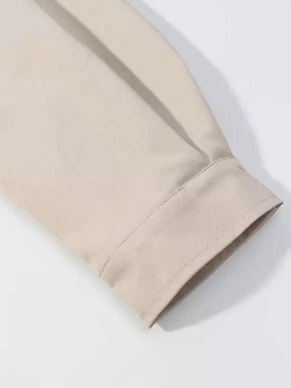 Ensemble 2 pièces : pantalon blanc plissé en polyester col rabattu manches longues.