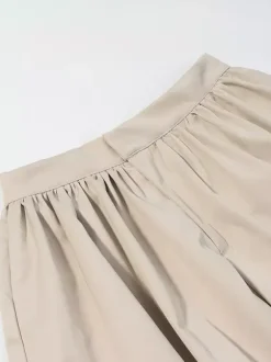 Ensemble 2 pièces : pantalon blanc plissé en polyester col rabattu manches longues.