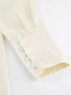 Ensemble 2 pièces pour femme : chemise à col et pantalon large style décontracté.