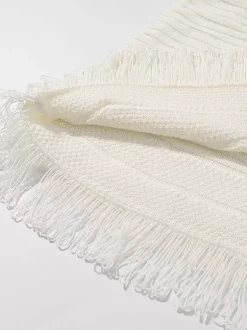 Ensemble 2 pièces pour femme : jupe blanche élégante à franges et revers manches longues.