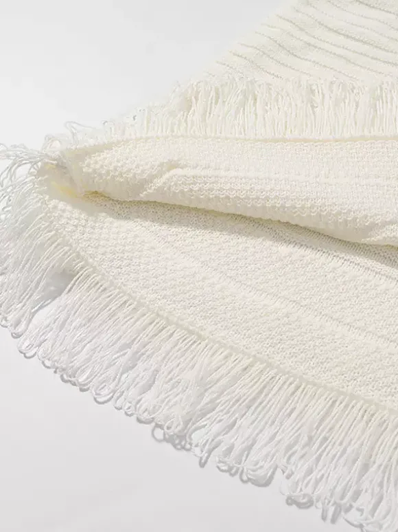 Ensemble 2 pièces pour femme : jupe blanche élégante à franges et revers manches longues.