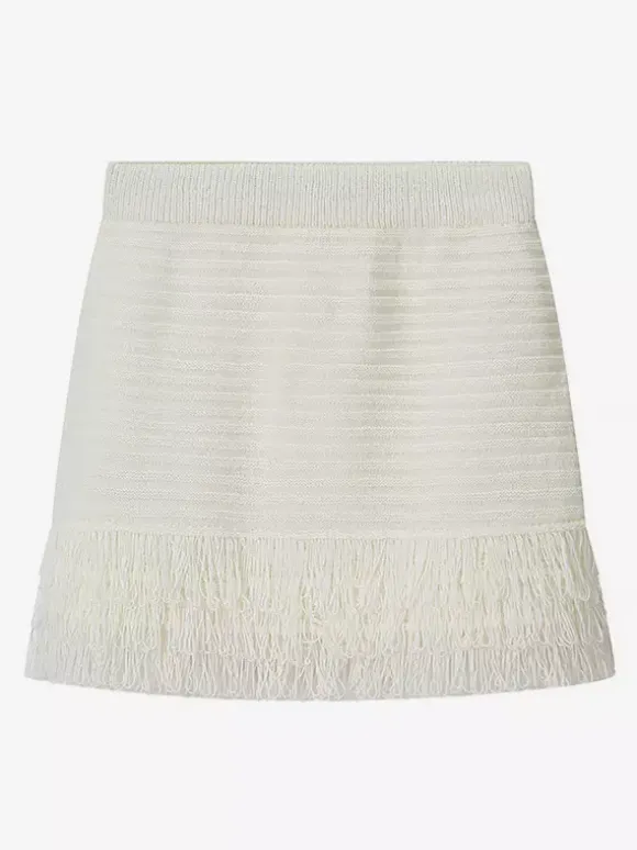 Ensemble 2 pièces pour femme : jupe blanche élégante à franges et revers manches longues.