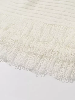Ensemble 2 pièces pour femme : jupe blanche élégante à franges et revers manches longues.