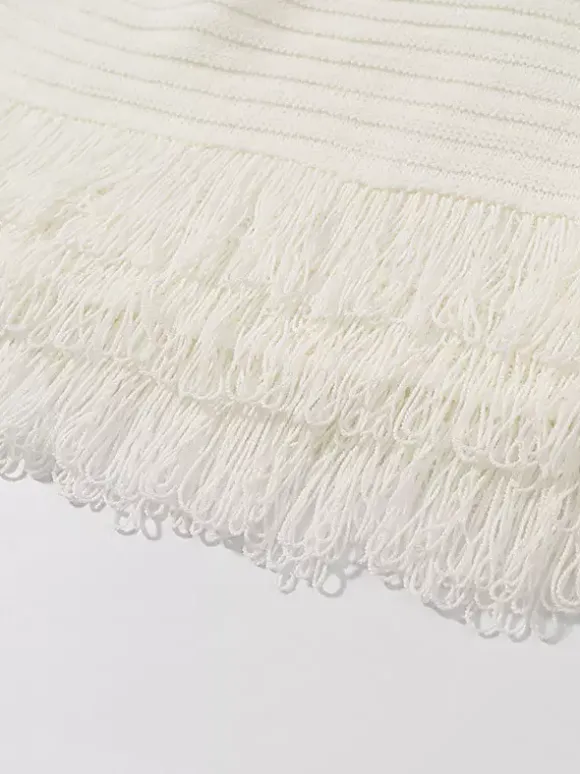 Ensemble 2 pièces pour femme : jupe blanche élégante à franges et revers manches longues.