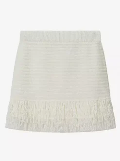 Ensemble 2 pièces pour femme : jupe blanche élégante à franges et revers manches longues.