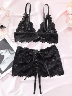 Ensemble soutien-gorge et culotte deux pièces en dentelle noire à fleurs sans entrejambe et sans bonnets avec n艙ud sur le devant.