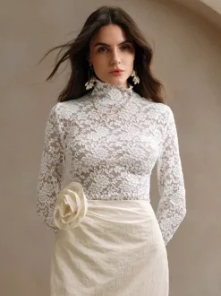 Haut à col montant en dentelle florale manches longues coupe ajustée et transparente pour femme 2026