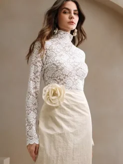 Haut à col montant en dentelle florale manches longues coupe ajustée et transparente pour femme 2026