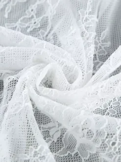 Jupes blanches en dentelle élégantes coupe asymétrique longueur genou bas pour femmes