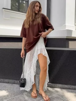 Jupes blanches en dentelle élégantes coupe asymétrique longueur genou bas pour femmes
