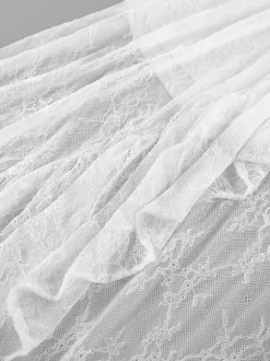 Jupes blanches en dentelle élégantes coupe asymétrique longueur genou bas pour femmes