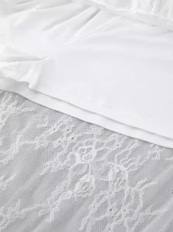 Jupes blanches en dentelle élégantes coupe asymétrique longueur genou bas pour femmes
