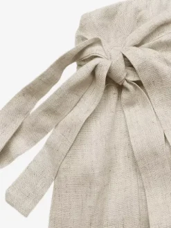 Jupe-short portefeuille en lin pour femme couleur abricot clair à nouer sur le côté style décontracté idéale pour l'été.