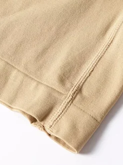 Linge de Mariée Lingerie sculptante couleur chair boutonnée sur le devant shorty gainant taille haute ajustable grandes tailles fermeture à agrafes effet ventre plat et fesses galbées sans coutures.