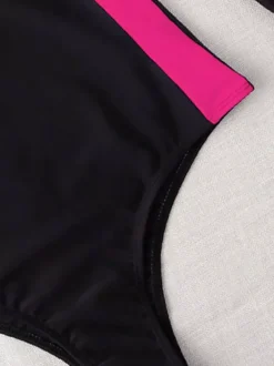 Maillot de bain une pièce anti-UV à manches longues et empiècements contrastés fermeture éclair sur le devant.