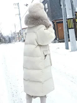 Manteau Matelassé Long Femme Comme Doudoune à Capuche avec Manches Longues à Zip avec Poches Unicolore Manteau Femme