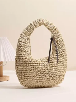Mini sac bandoulière en raphia et paille style croissant tissé ajouré sac hobo sac à main d'été pour la plage.