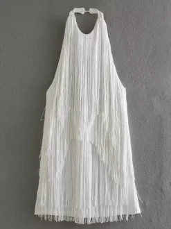 Mini-robe à franges et pompons dos nu et décolleté licou pour soirée 2026