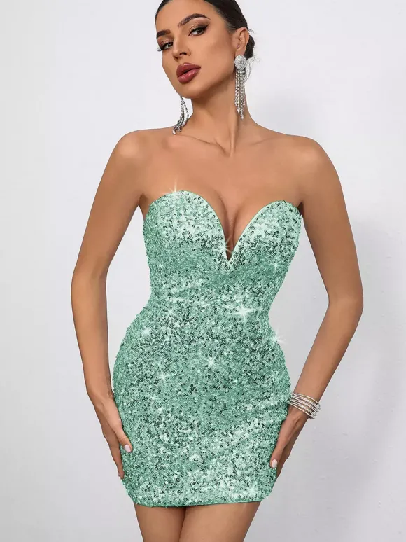Mini-robe moulante à sequins décolleté en c艙ur et n艙ud dans le dos idéale pour les fêtes 2026